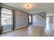 Bright living room with hardwood floors, neutral paint, large windows and a stylish light fixture at 15486 Dusty Trl, Noblesville, IN 46060