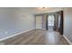 Cozy living room with hardwood floors, a bright window and a simple decor at 15486 Dusty Trl, Noblesville, IN 46060