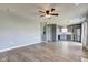 Open-concept living area with hardwood floors, connecting to the kitchen and dining spaces at 15486 Dusty Trl, Noblesville, IN 46060