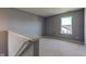 Second floor landing with gray walls and carpeted flooring at 15486 Dusty Trl, Noblesville, IN 46060