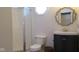 Well-lit bathroom featuring a corner shower, vanity, and tiled floors at 1588 E Us Highway 136, Hillsboro, IN 47949