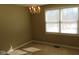 Bedroom with a hanging light fixture and two windows at 1588 E Us Highway 136, Hillsboro, IN 47949