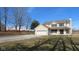 Charming two-story home with an attached two car garage, spacious yard, and a large barn at 1588 E Us Highway 136, Hillsboro, IN 47949