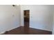 Hardwood flooring in hallway leading to the kitchen at 1588 E Us Highway 136, Hillsboro, IN 47949