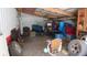 Loaded outbuilding for storage or hobbies, featuring shelving, tools, and workspace at 1588 E Us Highway 136, Hillsboro, IN 47949