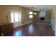 Spacious living room area with fireplace, hardwood flooring, and french doors to the outside at 1588 E Us Highway 136, Hillsboro, IN 47949