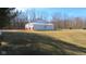 A well-kept outbuilding with ample space and a red and white exterior at 1588 E Us Highway 136, Hillsboro, IN 47949