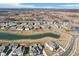 Expansive aerial view of a planned community with various houses, ponds, and green spaces at 15969 Sonnet Park Ln, Westfield, IN 46074