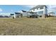 Expansive lawn behind this modern home, featuring a deck with pergola and walkout basement at 15969 Sonnet Park Ln, Westfield, IN 46074