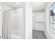 Well-lit bathroom with a shower, a walk-in closet, and neutral colors that create a clean and inviting atmosphere at 15969 Sonnet Park Ln, Westfield, IN 46074