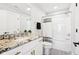 Elegant bathroom featuring granite countertops, a modern sink, a shower-tub combo, and sleek gold hardware at 15969 Sonnet Park Ln, Westfield, IN 46074