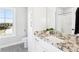 Modern bathroom with granite countertops, a sleek sink, a shower-tub combo, and contemporary design elements at 15969 Sonnet Park Ln, Westfield, IN 46074