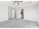 Cozy bedroom with a ceiling fan, plush carpet, and an ensuite bathroom for ultimate comfort and convenience at 15969 Sonnet Park Ln, Westfield, IN 46074