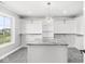 Walk-in closet with custom shelving, a center island and natural light at 15969 Sonnet Park Ln, Westfield, IN 46074