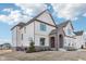 Two-story home showing brick entryway, manicured lawn, and modern exterior finishes at 15969 Sonnet Park Ln, Westfield, IN 46074