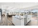 Bright open concept kitchen with island, stainless steel appliances and an adjacent Gathering room at 15969 Sonnet Park Ln, Westfield, IN 46074