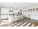 Spacious kitchen with an island and barstool seating, and modern stainless appliances at 15969 Sonnet Park Ln, Westfield, IN 46074
