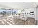 Modern kitchen with white cabinets, granite countertops, and stainless steel appliances at 15969 Sonnet Park Ln, Westfield, IN 46074