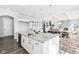 Bright, spacious kitchen with granite counters, an island with a sink, and modern white cabinetry at 15969 Sonnet Park Ln, Westfield, IN 46074
