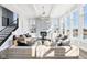 Inviting living room with stylish decor, a stone fireplace, and plenty of natural light at 15969 Sonnet Park Ln, Westfield, IN 46074