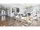Bright living room features a stone fireplace, hardwood floors, and abundant natural light at 15969 Sonnet Park Ln, Westfield, IN 46074