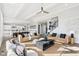 Bright and airy living room featuring hardwood floors and an open layout to the kitchen at 15969 Sonnet Park Ln, Westfield, IN 46074