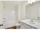 Modern full bathroom featuring shower-tub combo, toilet, and vanity with sink at 19487 Grassy Branch Rd, Westfield, IN 46074