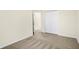 Comfortable bedroom features a double closet, neutral carpet, light walls, and bright overhead lighting at 19487 Grassy Branch Rd, Westfield, IN 46074