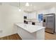 Modern kitchen showcasing stainless steel appliances, white cabinetry, and a center island at 19487 Grassy Branch Rd, Westfield, IN 46074