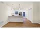 Modern kitchen with stainless steel appliances, white cabinetry, and breakfast bar at 19487 Grassy Branch Rd, Westfield, IN 46074