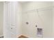 Convenient laundry room featuring hookups, shelf, and laminate flooring at 19487 Grassy Branch Rd, Westfield, IN 46074