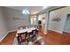 Spacious dining room with hardwood floors, neutral paint, and plenty of natural light at 2228 Silver Rose Dr, Avon, IN 46123