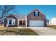 Charming brick home features a two-car garage, bay window, and well-maintained front yard at 2228 Silver Rose Dr, Avon, IN 46123