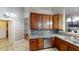 This is a beautifully appointed kitchen with wooden cabinetry and stainless steel appliances at 2228 Silver Rose Dr, Avon, IN 46123