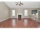 Spacious living room features a fireplace, wood-look floors, and abundant natural light at 2228 Silver Rose Dr, Avon, IN 46123