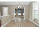 Bright living room featuring stylish flooring with archway that connects to the sunroom at 2228 Silver Rose Dr, Avon, IN 46123