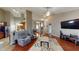 Open concept living room with hardwood floors, neutral walls, and lots of natural light at 2228 Silver Rose Dr, Avon, IN 46123