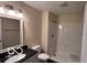 Bright bathroom featuring white shower and bath combination, toilet, and vanity with dark countertop at 229 Hillendale Dr, Greenwood, IN 46142