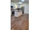 Modern kitchen with stainless steel appliances, island with seating, and white cabinets for ample storage at 229 Hillendale Dr, Greenwood, IN 46142
