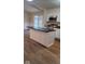 Well-appointed kitchen features a large island with modern stainless steel appliances and plenty of counter space at 229 Hillendale Dr, Greenwood, IN 46142
