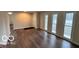Spacious living room boasts abundant natural light from large windows and features sleek hardwood floors at 229 Hillendale Dr, Greenwood, IN 46142