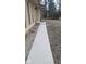 A concrete pathway leads to the home entrance bordered by decorative stone and a neatly maintained lawn at 229 Hillendale Dr, Greenwood, IN 46142