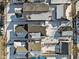 An aerial view shows houses on a sunny winter day with snow-covered roofs and ground at 234 N State Ave, Indianapolis, IN 46201