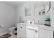 Bathroom featuring a double vanity with a white countertop, and modern fixtures at 234 N State Ave, Indianapolis, IN 46201