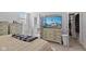 Bright bedroom with a comfortable bed, dresser with a TV, and an en-suite bathroom at 234 N State Ave, Indianapolis, IN 46201