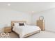 Comfortable bedroom with a bed and dresser at 234 N State Ave, Indianapolis, IN 46201