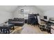 Bright bonus room featuring an office and grey sofa, perfect for relaxing or working at 234 N State Ave, Indianapolis, IN 46201