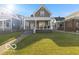 Charming two-story home featuring a well-maintained lawn and inviting front porch at 234 N State Ave, Indianapolis, IN 46201