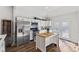 Bright kitchen features stainless steel appliances, modern cabinetry, and a kitchen island with butcher block top at 234 N State Ave, Indianapolis, IN 46201