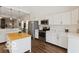 Modern kitchen with stainless steel appliances, white cabinetry, and central island at 234 N State Ave, Indianapolis, IN 46201